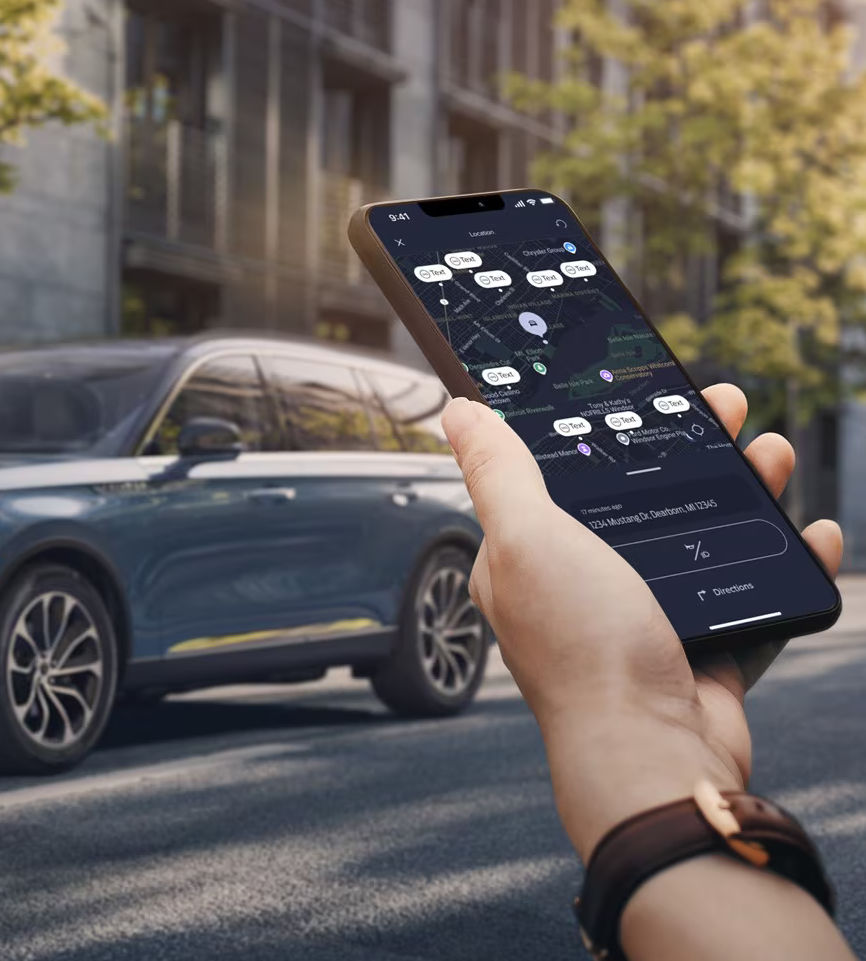 Smartphone displaying a navigation app near a parked blue SUV on a city street.